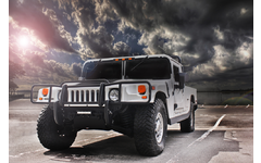 HUMMER vehicle parked with cloudy sky background