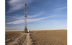 Fracking rig in dirt field