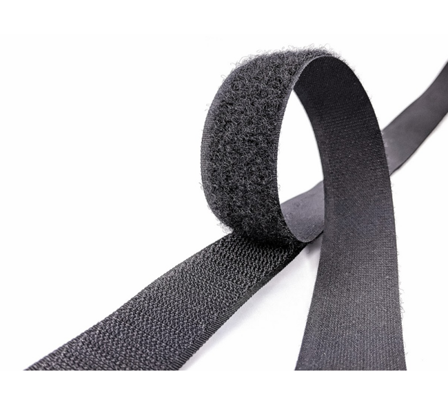 Hook-and-loop fastener aka Velcro in closeup, isolated on black Stock Photo