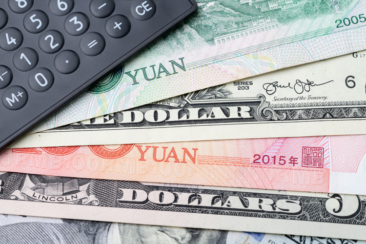 black calculator on US dollar and china yuan banknotes, tariff deal for major countries.