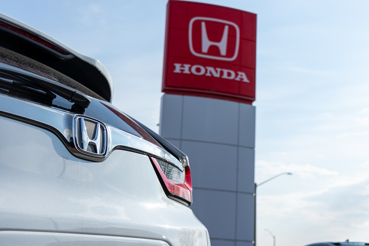 Honda sign and car 