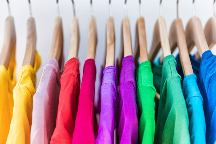 Multicolored clothing on hangers