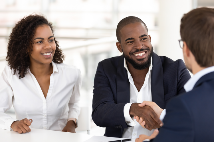 Two people shaking hands with loan provider 