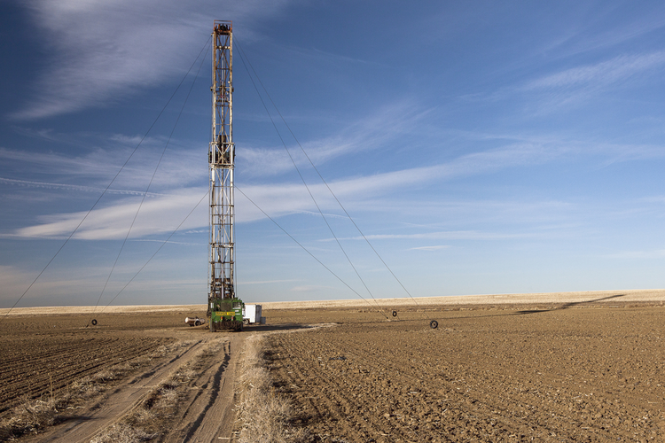 Fracking rig in dirt field