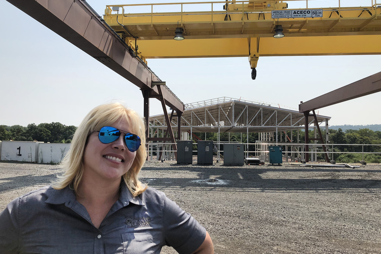 Karen Norheim standing in front of worksite