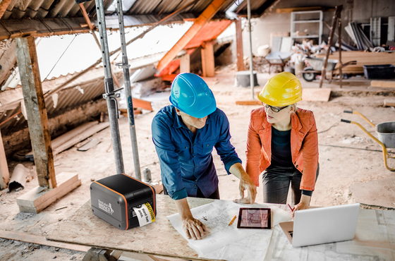 Two People Working On Construction Project