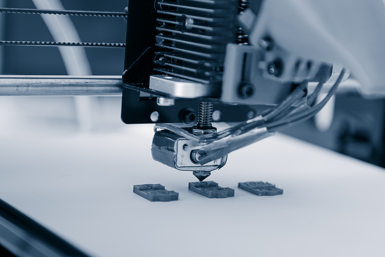 3D printer creating plastic parts