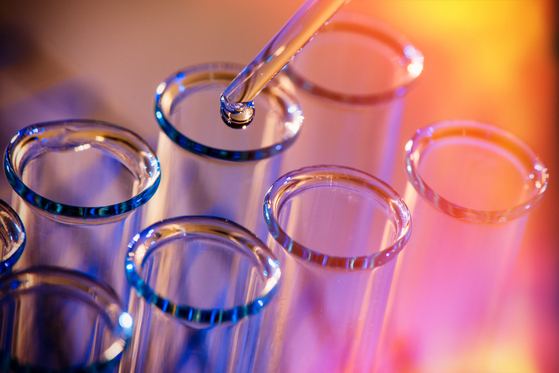 Chemicals being dropped in test tubes