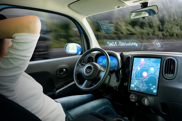 Cockpit of a car running in self driving mode with a relaxed driver.
