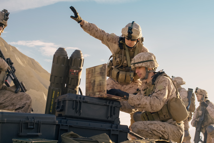 Soldiers Using Laptop Computer for Surveillance During Military Operation in the Desert.