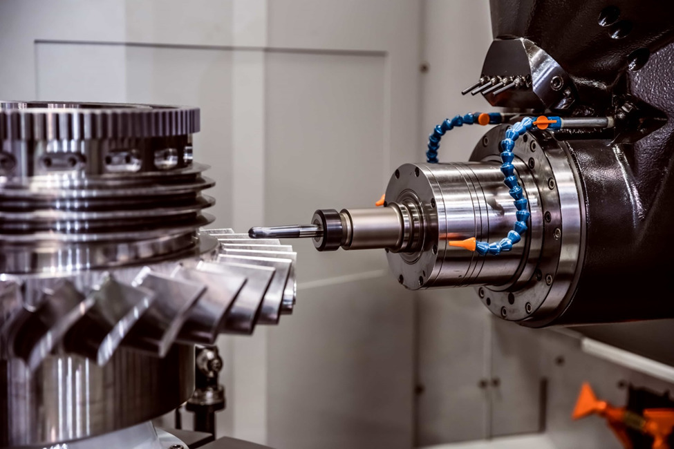 A horizontal CNC milling machine performing a milling operation on a metal part.