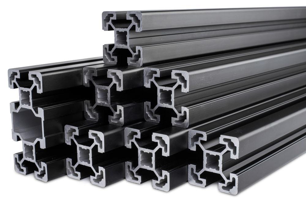 A stack of black anodized aluminum extrusion bars.