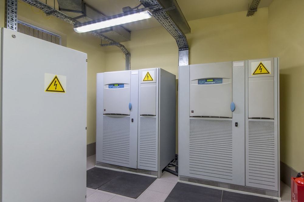 A large UPS (Uninterruptible Power Supply) operating in a data center.