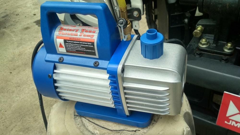 A vacuum pump used for removing refrigerant from a cooling system.