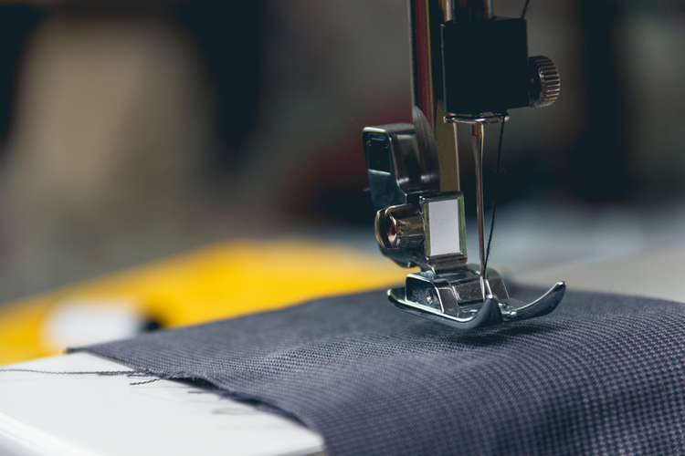 Closeup of sewing machine and fabric