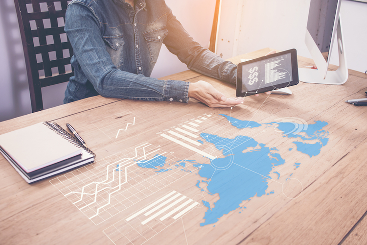 Woman using tablet to analyze supply chain spend