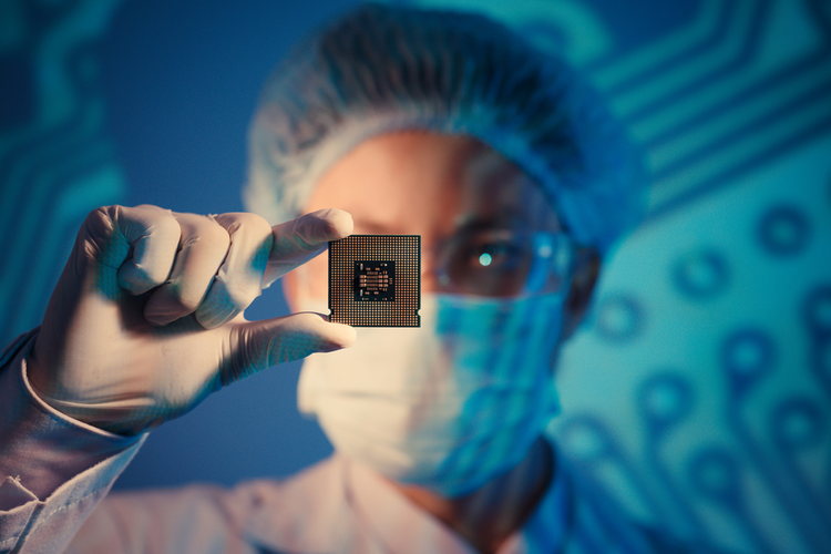 Computer engineer holding a microchip
