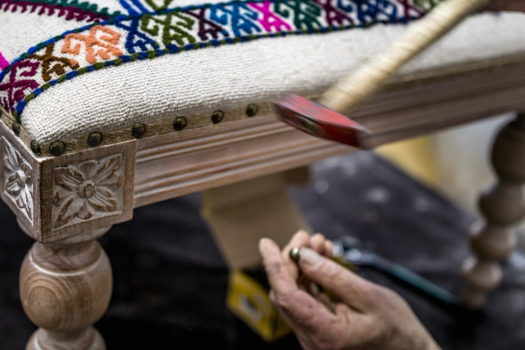 Worker in upholstery workshop