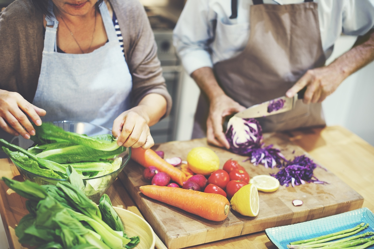 Two people cooking in the kitchen