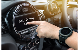 Finger Pushing Self-Driving Mode Button on Car's Dashboard.