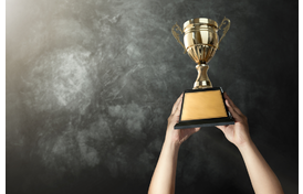 Man holding a trophy