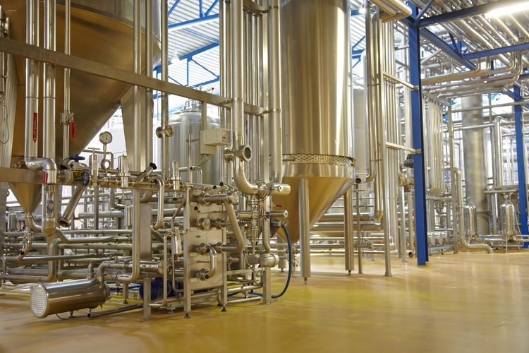 Piping systems and vats in a brewery.
