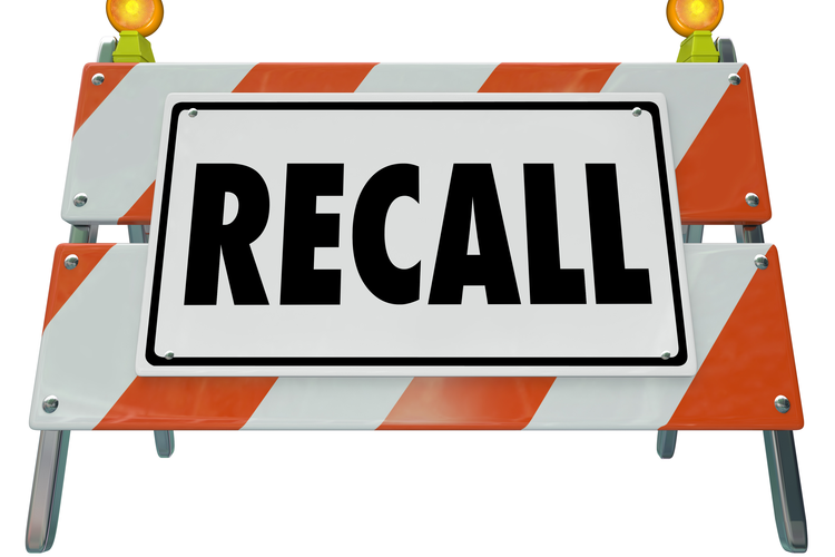The word 'Recall' on a barrier or blockade warning sign.
