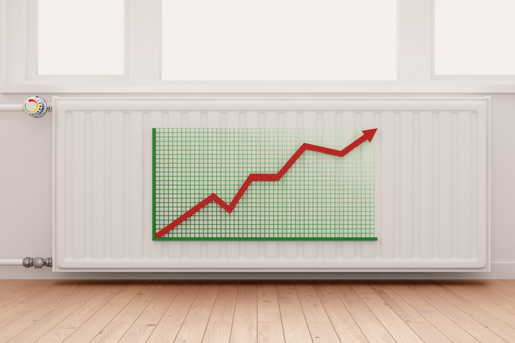 Ascending arrow graph on a heating radiator showing conceptual the increasing costs of energy.