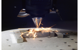 Detail of 3D printer printing a metal piece
