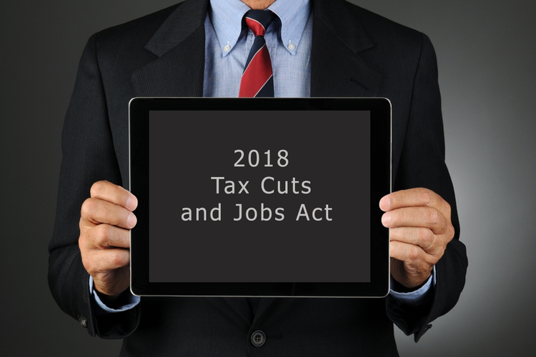 Businessman holding a tablet that says