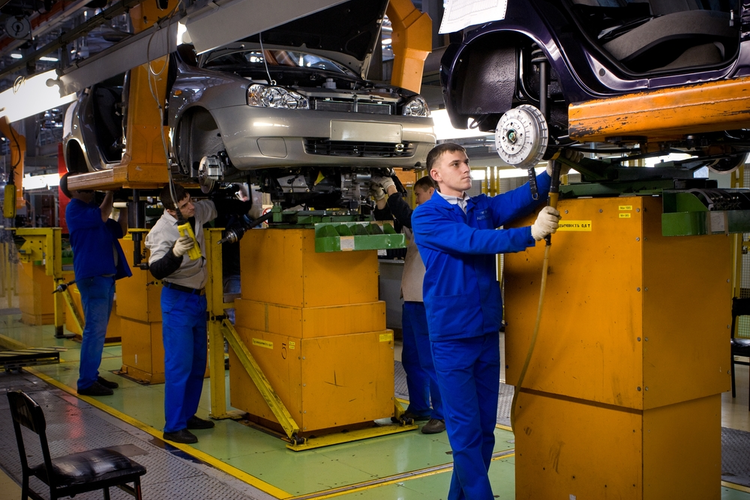 Car assembly line employees.