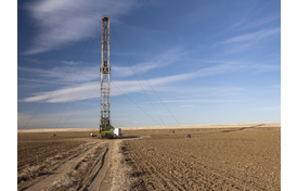 Fracking rig in dirt field