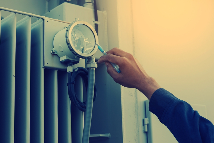 Electrician checking the status of a step up transformer.