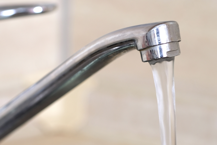 Water flowing from faucet.