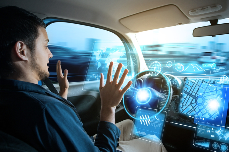 Man riding in autonomous car.