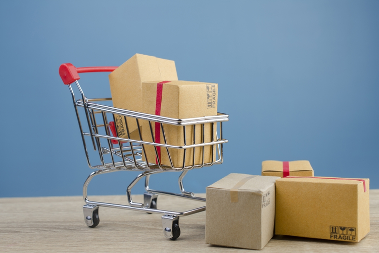 Boxes in a shopping cart.