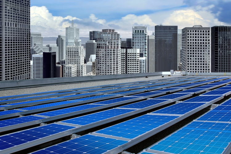 Solar panels on the roof of a modern skyscraper.