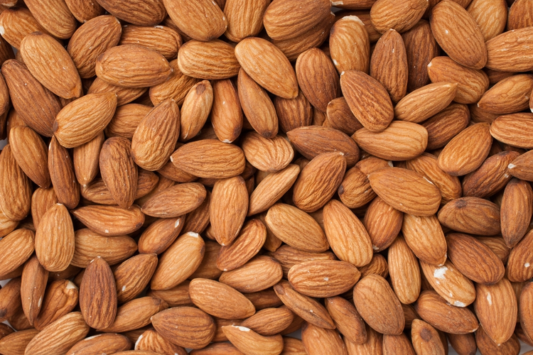 Close-up image of peeled almonds.